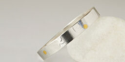 Embossed bangle with starfish and swirl