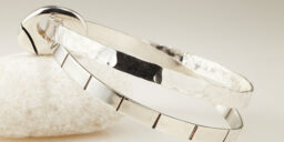 Two Flat Bangles Joined by a solid Silver Pebble