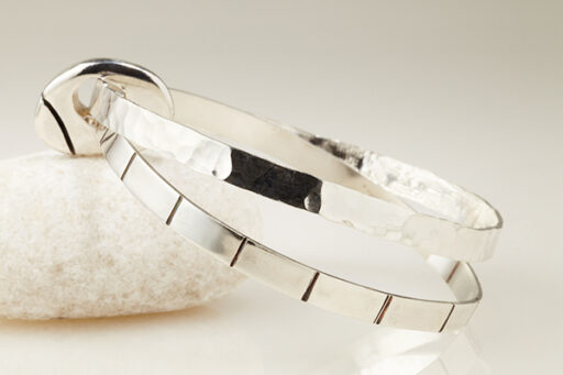Two Flat Bangles Joined by a solid Silver Pebble