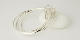 Three Recycled Silver Bangles Connected with a Two Silver Hearts