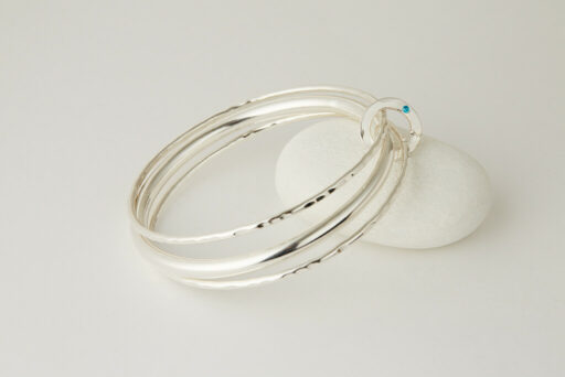 Three Recycled Silver Bangles Connected with a Bronze & Silver Disc - Image 3