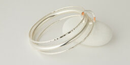 Three Recycled Silver Bangles Connected with a Copper Decorated Disc