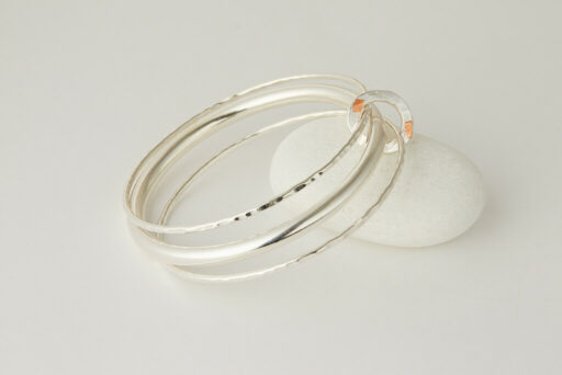 Three Recycled Silver Bangles Connected with a Bronze & Silver Disc - Image 2