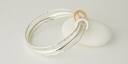 Three Recycled Silver Bangles Connected with a Bronze & Silver Disc