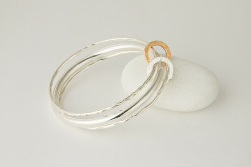 Three Recycled Silver Bangles Connected with a Bronze & Silver Disc